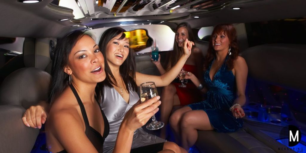 women having fun in a limousine