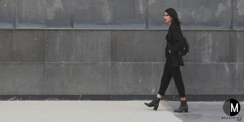 woman walking on sidewalk