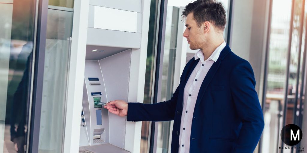 man using an ATM