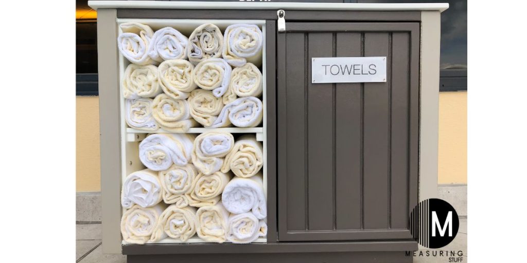 pool towels in a cabinet