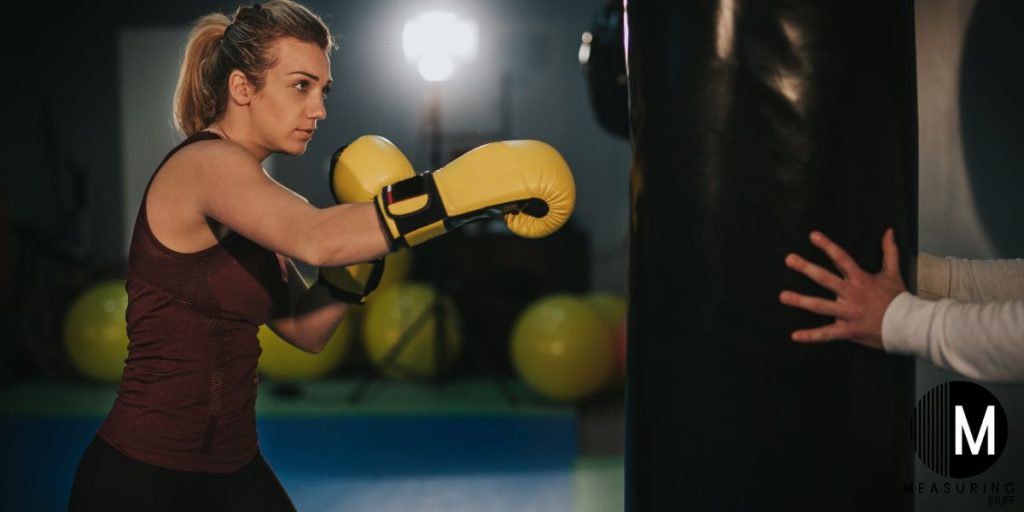 woman punching a punching bag