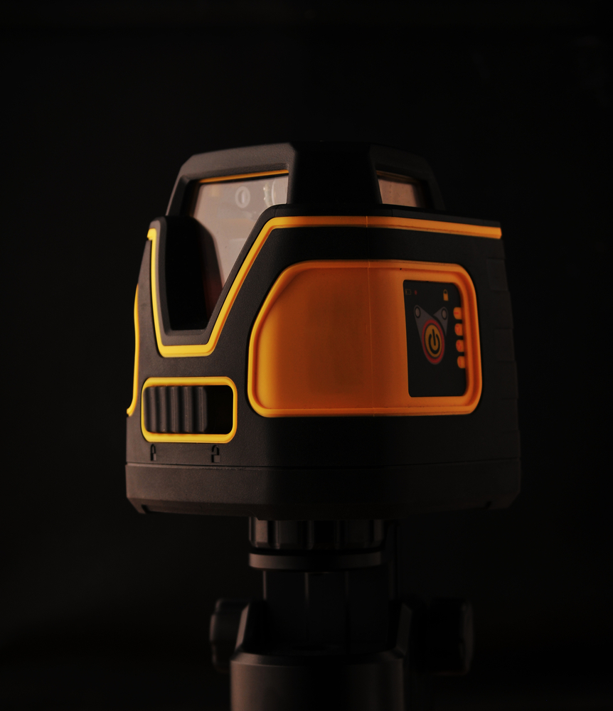 Device laser level on black background