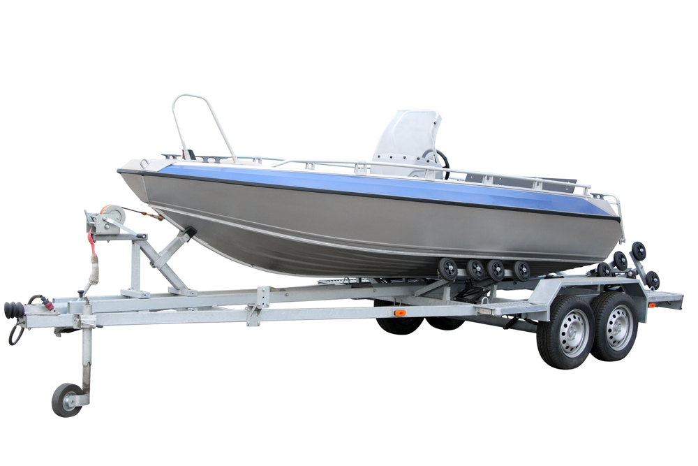 Motor Boat and trailer separately on a white background
