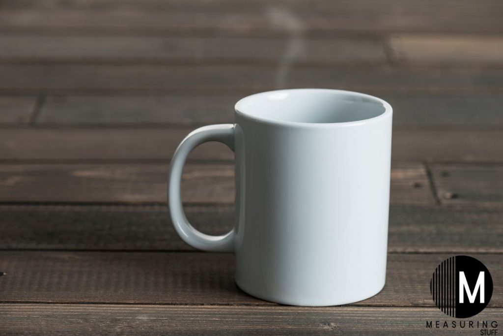 white ceramic coffee mug on wooden table