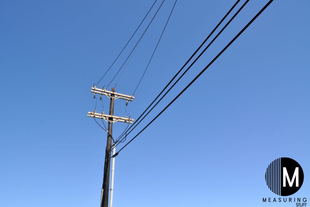 telephone pole with wires attached