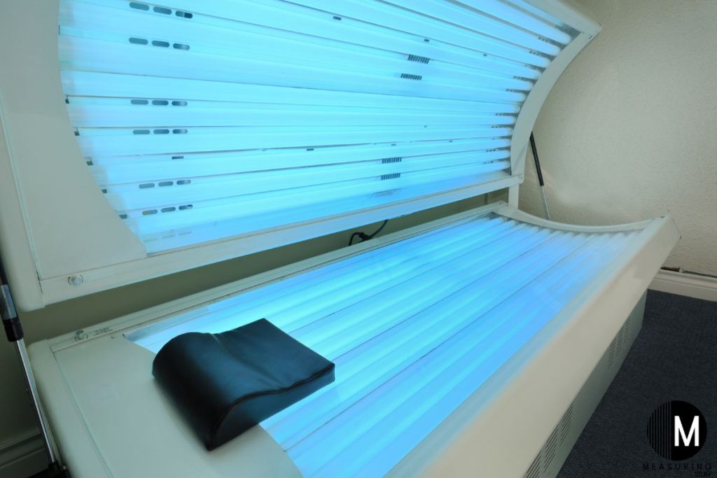open tanning bed with lights on