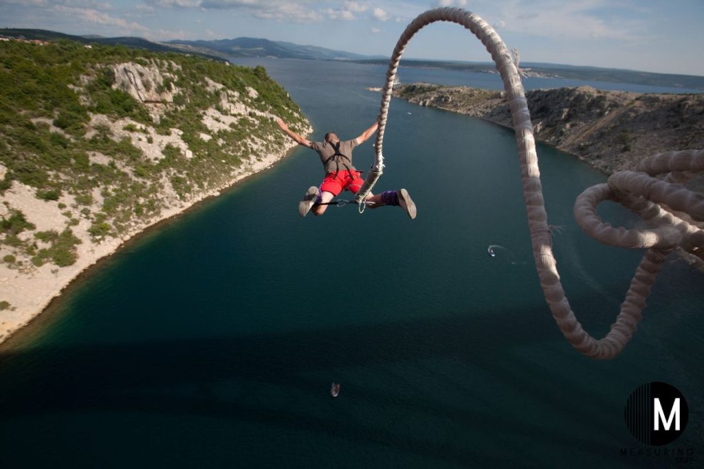 man attached to a bungee jump rope