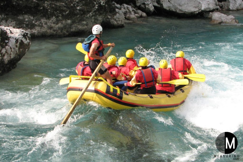 several people white water rafting