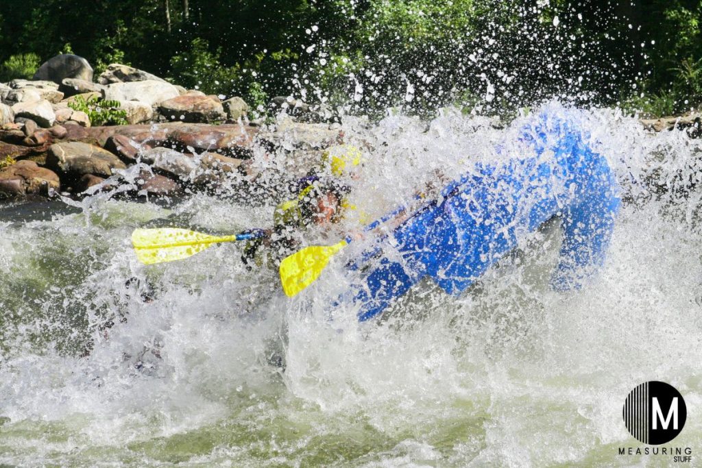 inflatable boat splashing in river