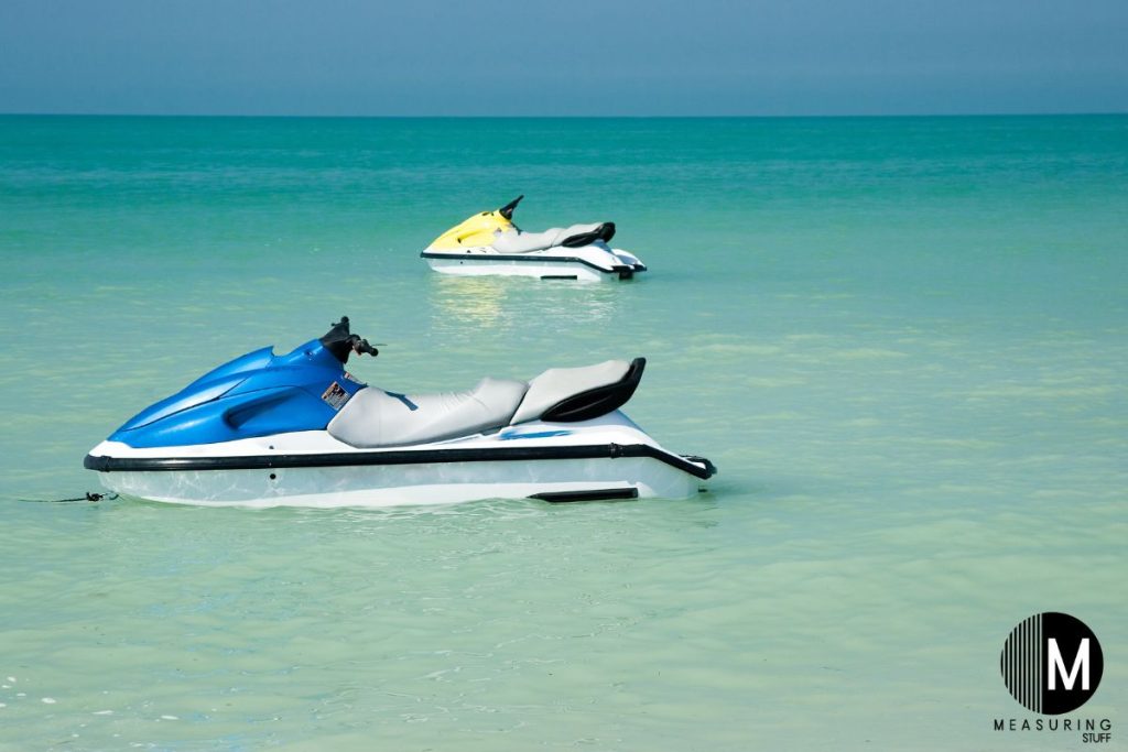 pair of jet skis sitting in the water