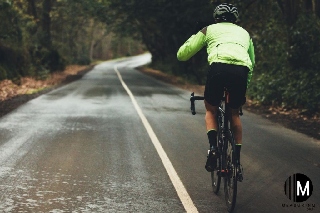 man biking in the rain