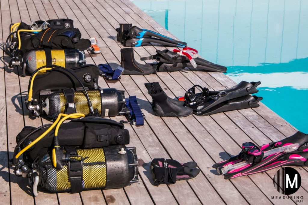 scuba diving gear on a wharf