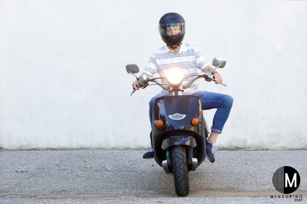 man sitting on a moped