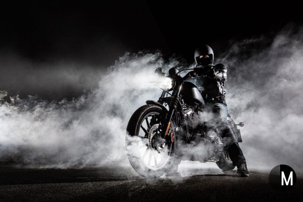 riding a motorcycle and night with smoke