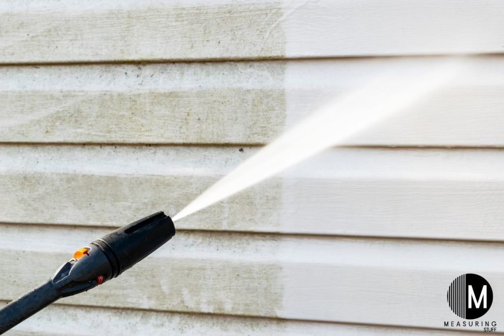 pressure washing a vinyl house