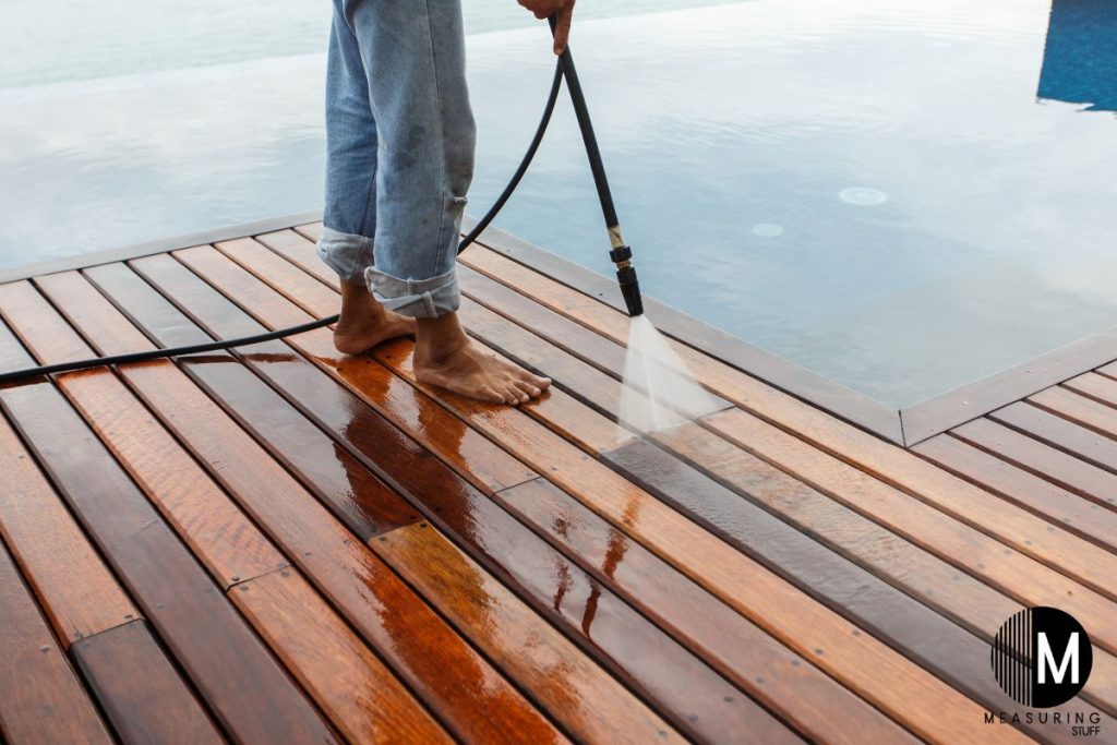 pressure washing a wooden deck