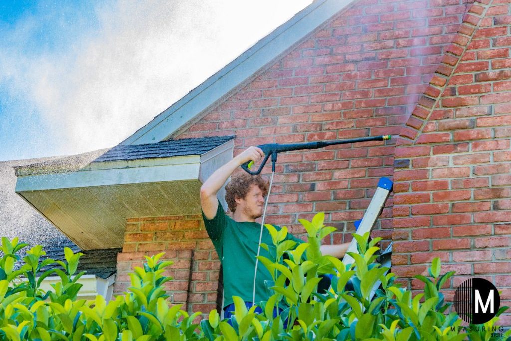 pressure washing a brick house