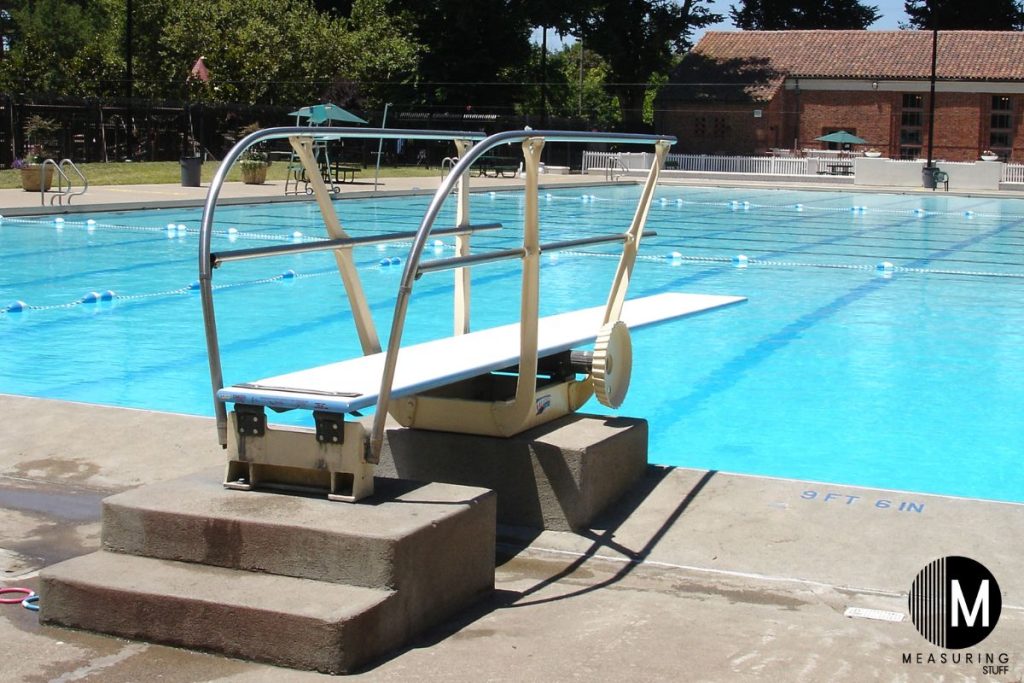 diving board at a large outdoor pool
