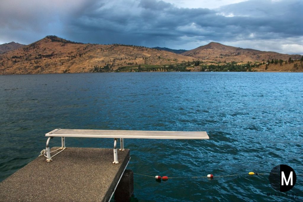 diving board on a dock of a lake