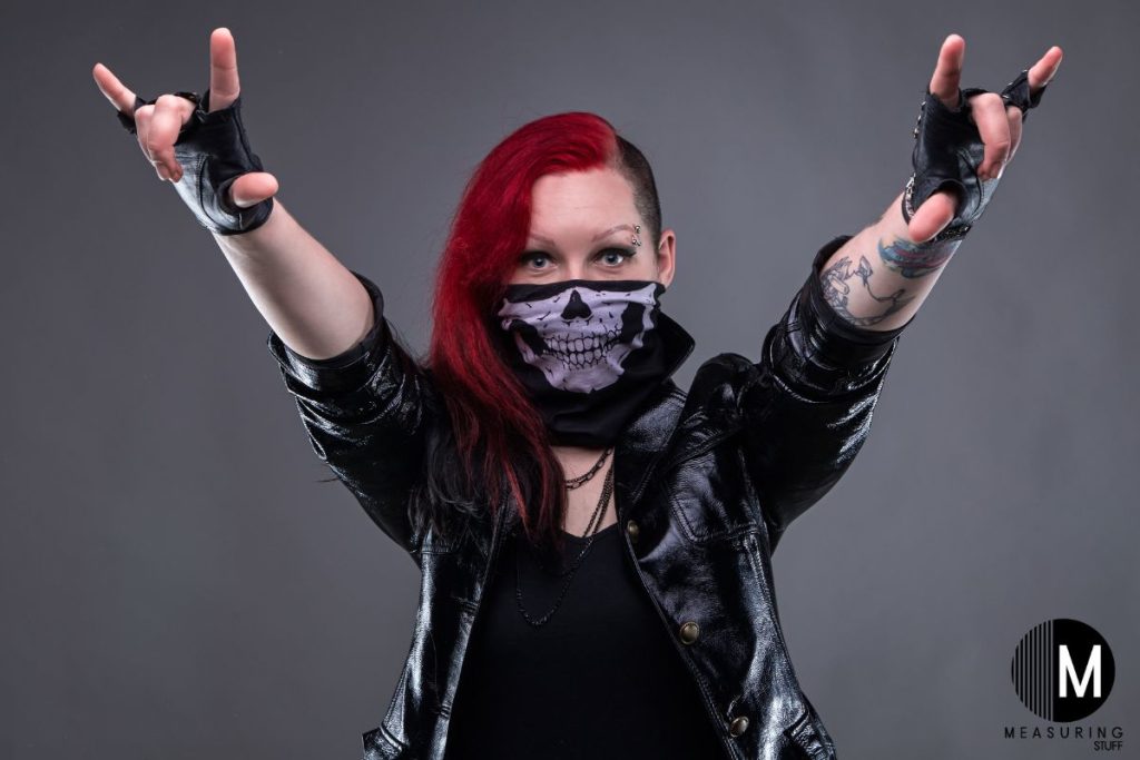 punk girl wearing a skull bandana on her face