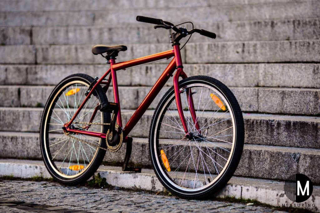 bike leaning against a brick wall