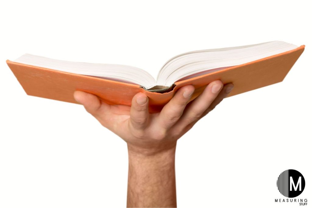 hand holding an open book