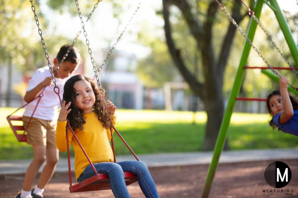 kids playing on a swing set
