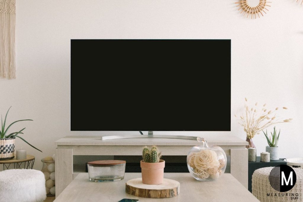 flat screen tv sitting on a stand