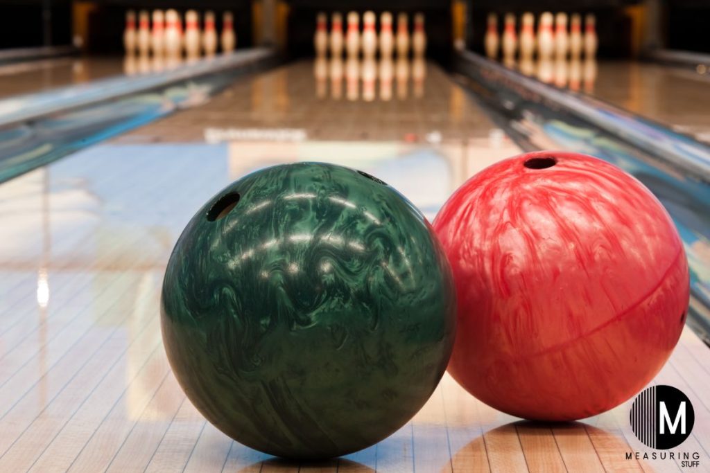 pair of bowling balls on a lane