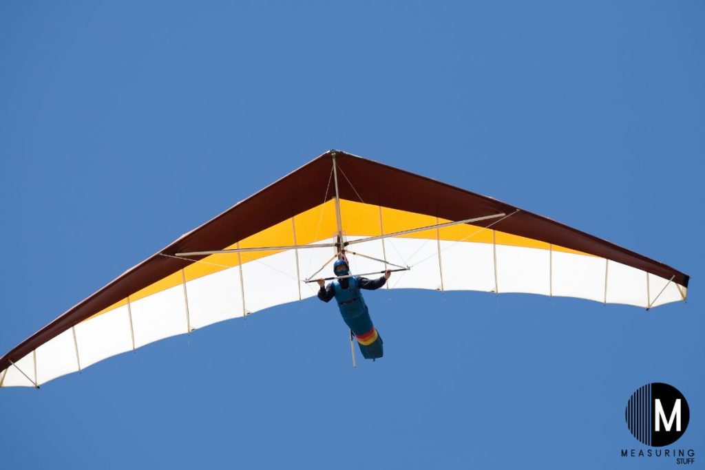 solo hang gliding clear skies