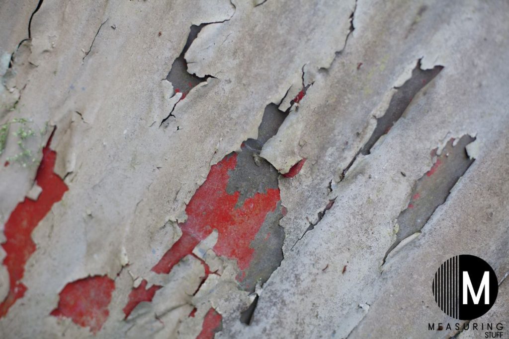 peeling paint on wooden wall