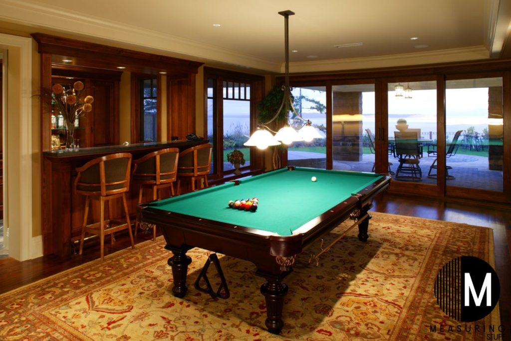 pool table next to a bar in a home