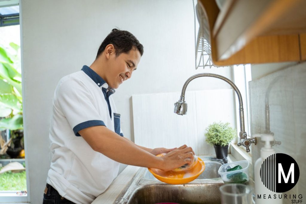 man washing dishes 
