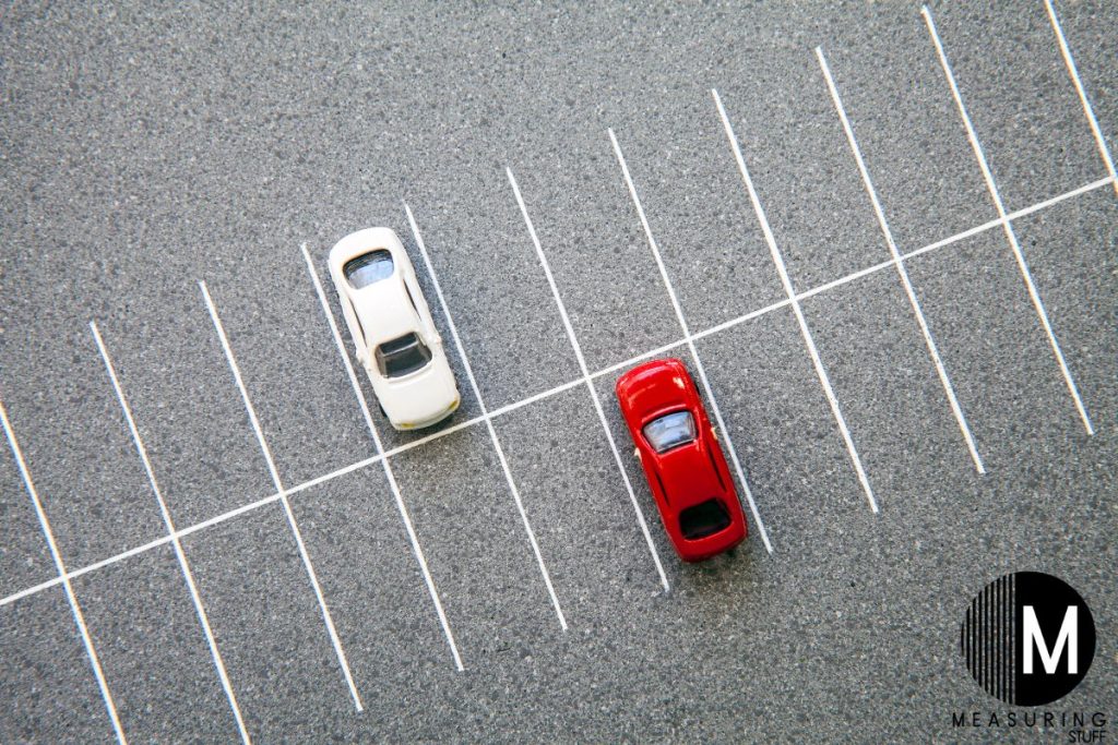 red and white car in parking lot