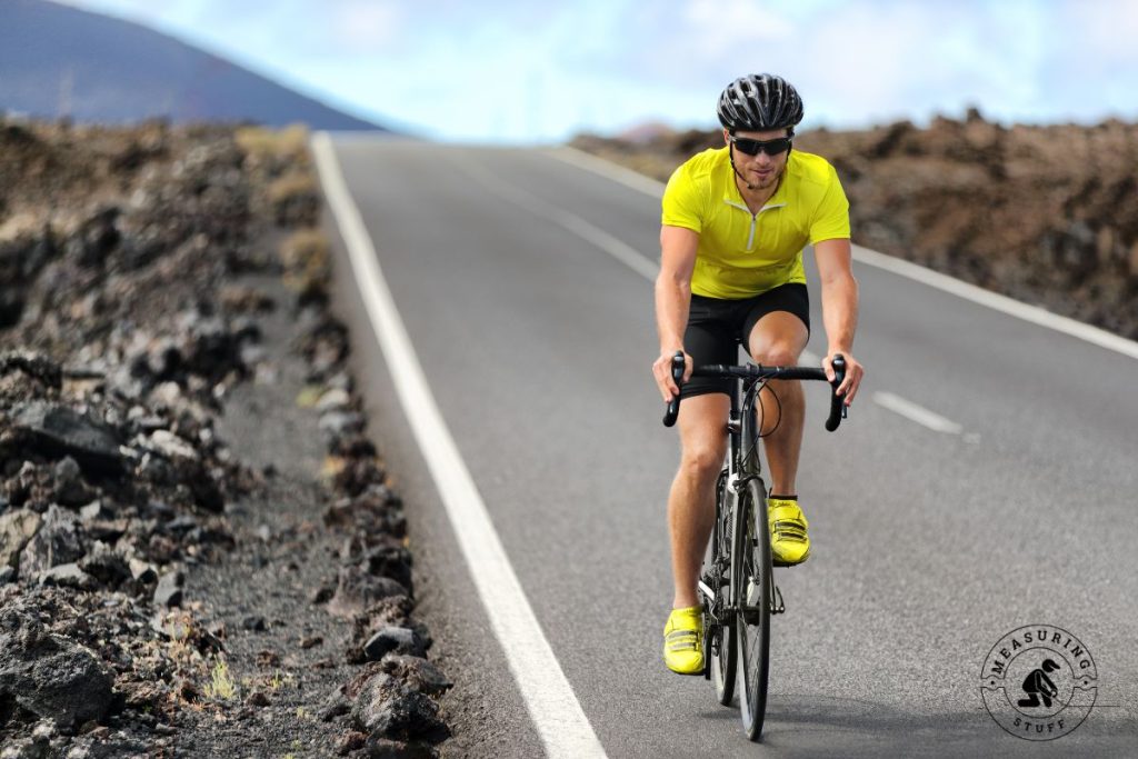 man riding a road bike on the highway