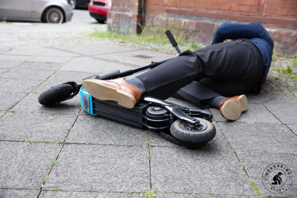 man fall off an electric scooter