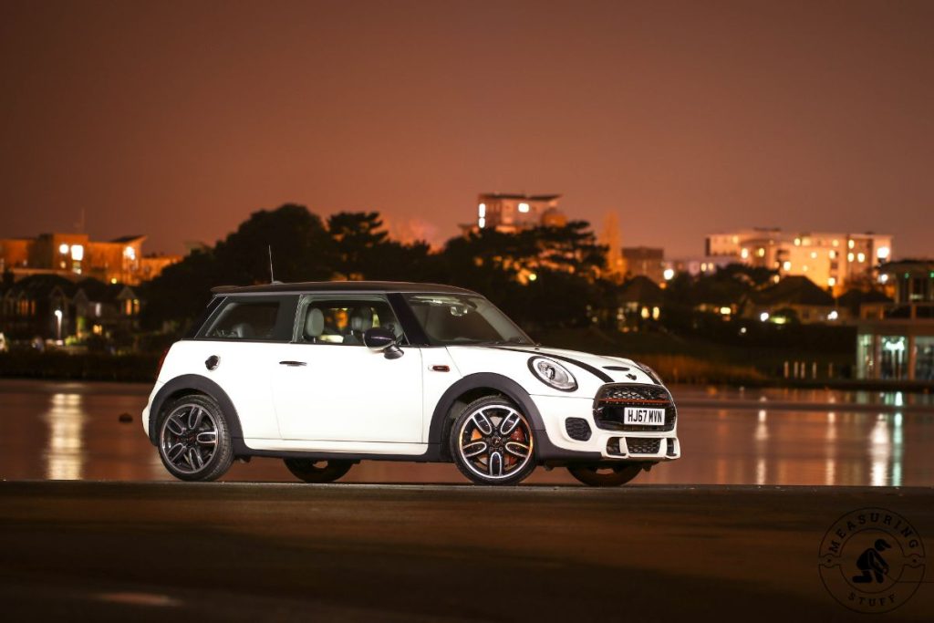 white and black mini cooper hatchback car