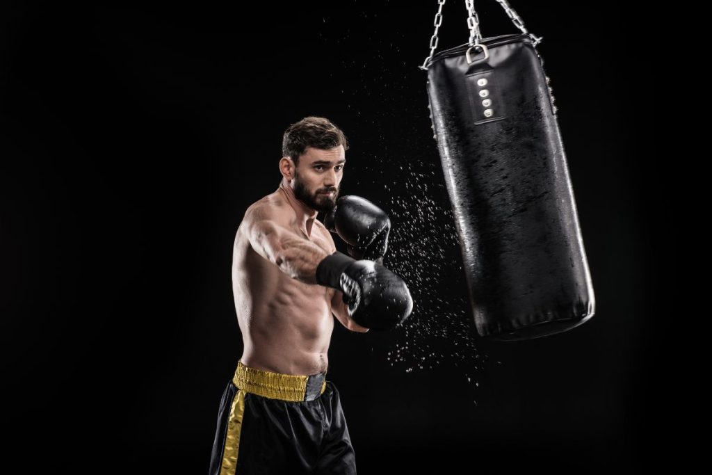 man punching a punching bag