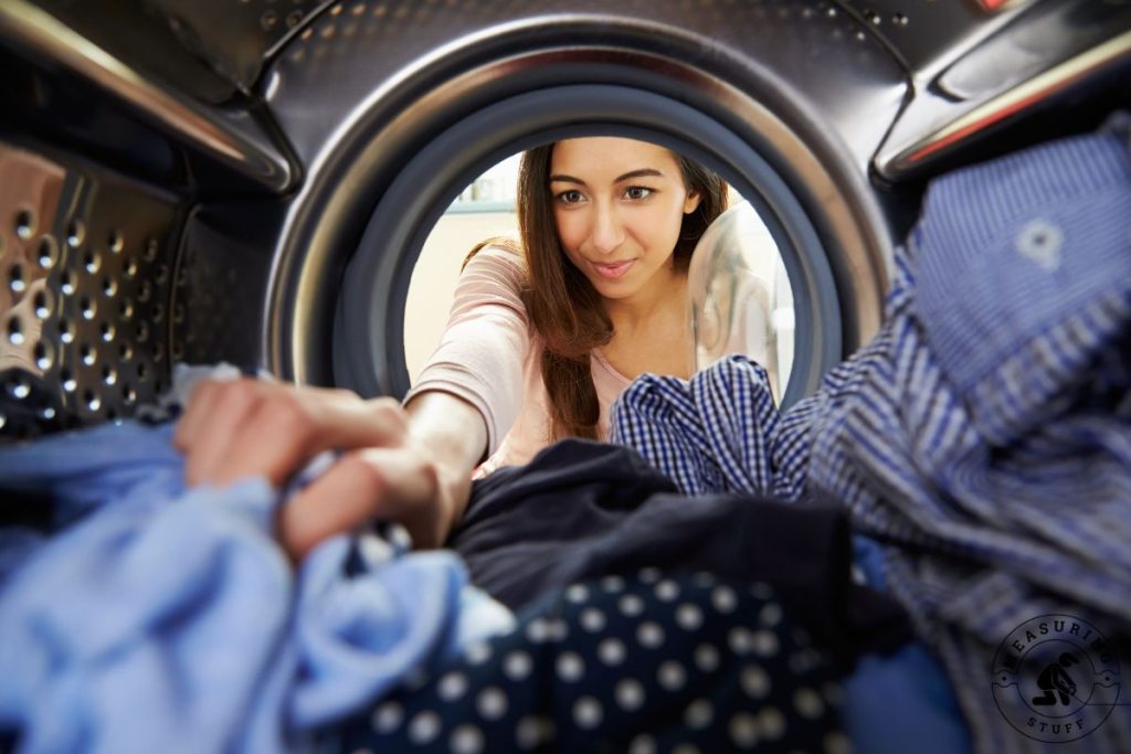 woman loading a washing machine