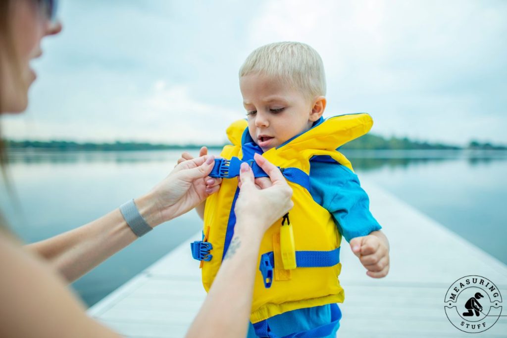 young child wearing a life jacket