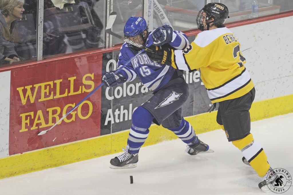 Ice hockey players battling on the ice