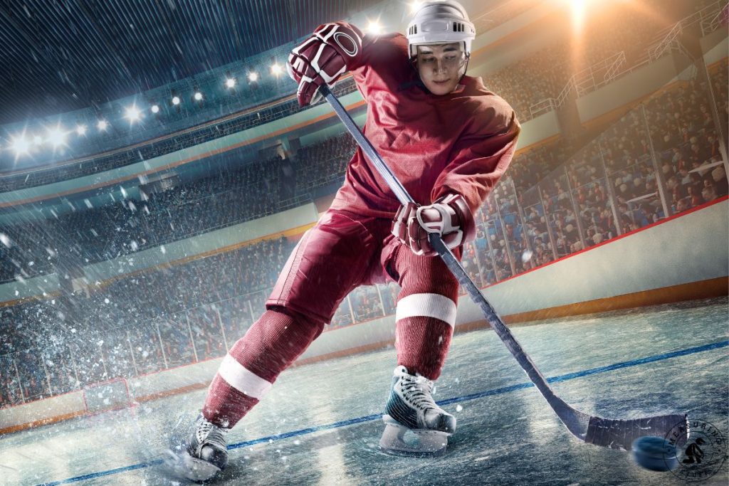 ice hockey player skating with a stick and puck