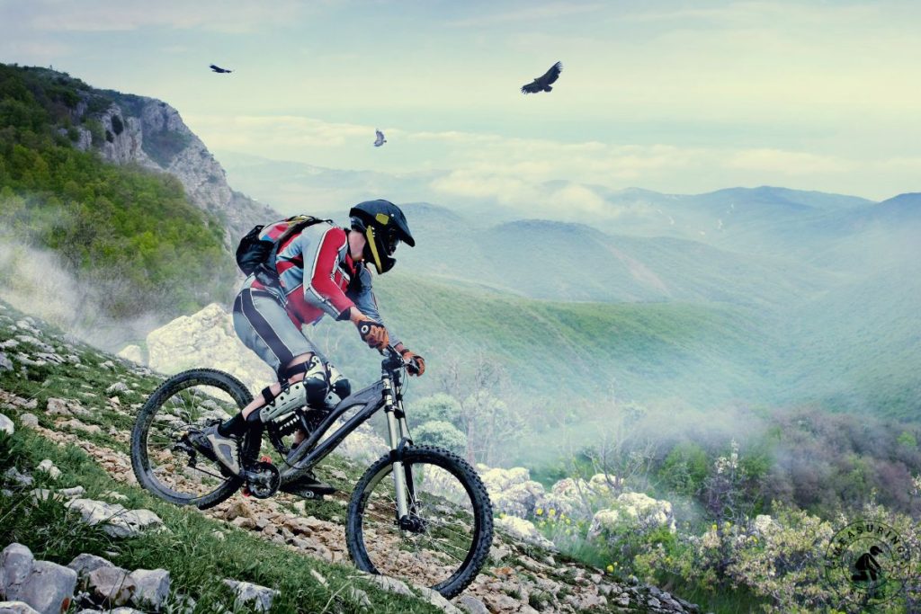 riding a mountain bike on a rocky hill