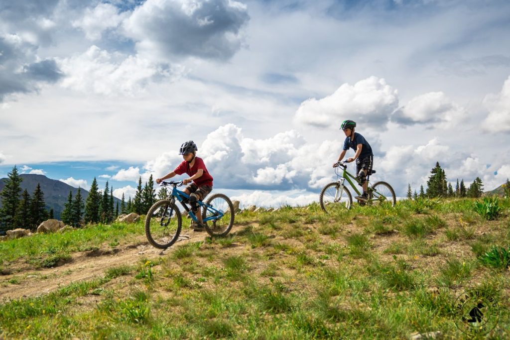 father and son riding mountain bikes