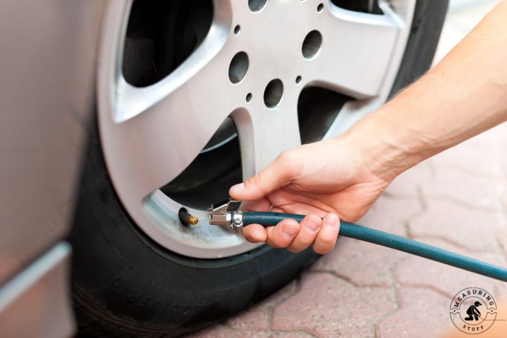 filling a car tire with air