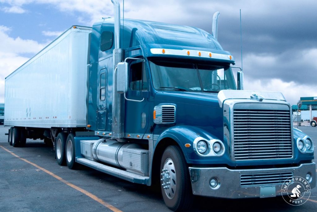 blue semi truck with trailer parked