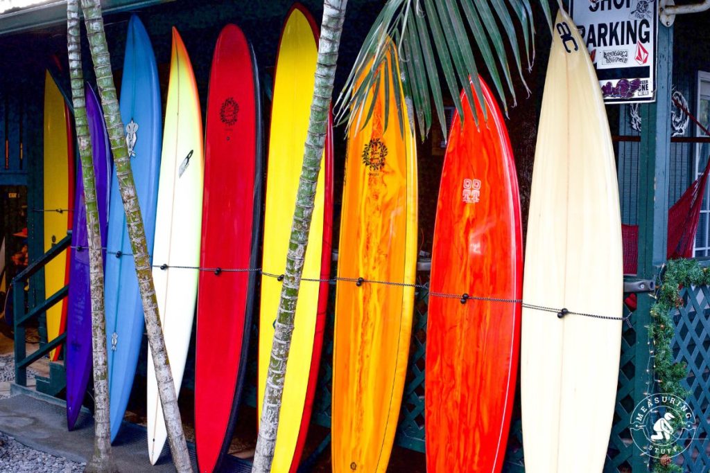 surfboards leaning against a wall