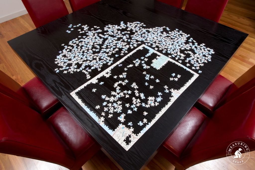 puzzle being made on a wooden coffee table