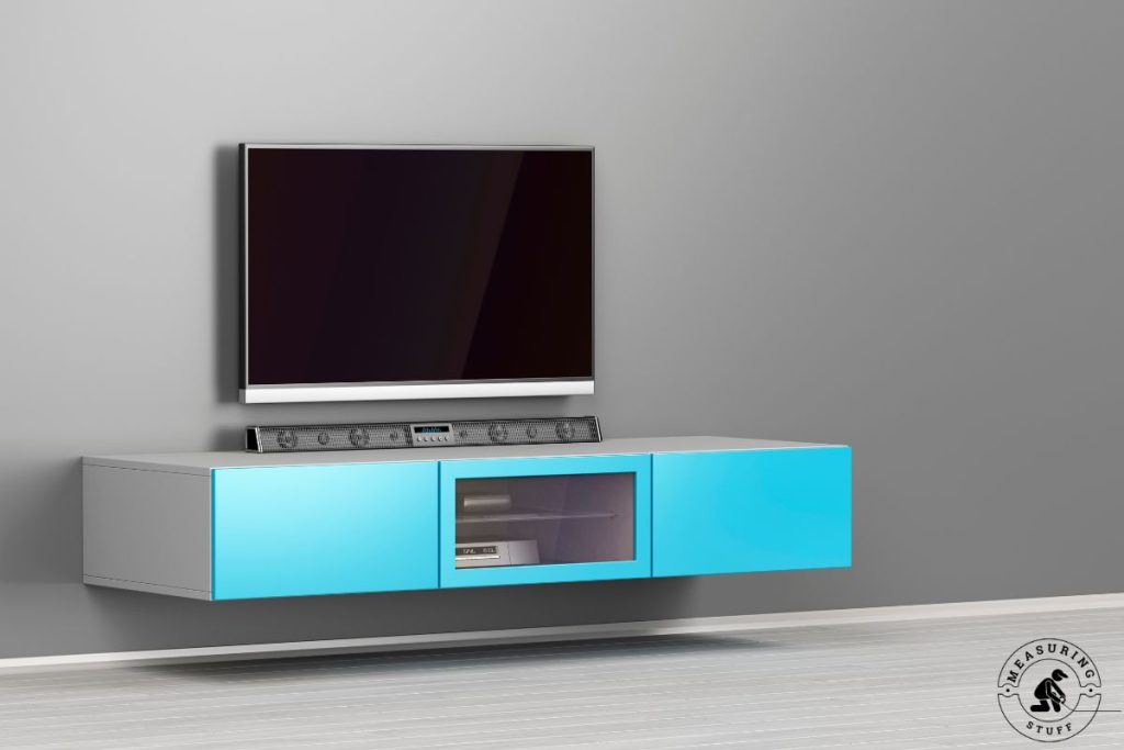 soundbar on a large shelf below a tv