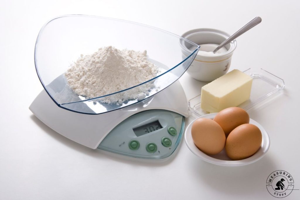 food scale with flour and eggs